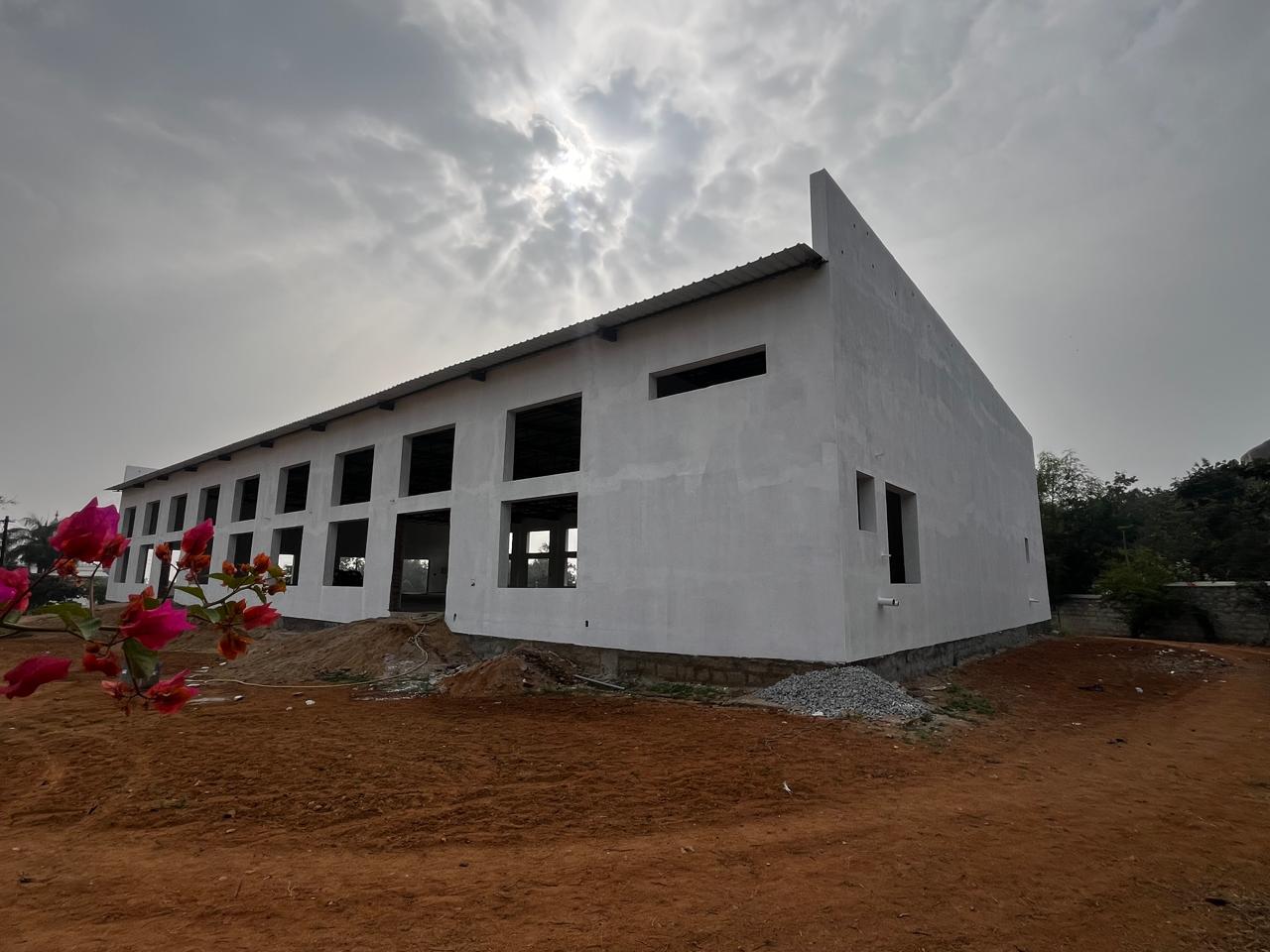 Kalyana Mandapam exterior view with hills in the background